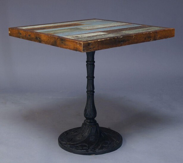 A painted wood and cast iron side table, of recent...
