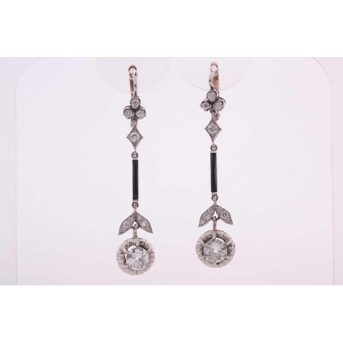 A pair of Art Deco diamond drop earrings, each set with a ro...