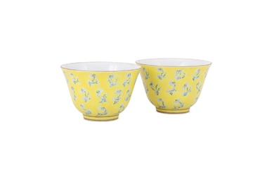 A pair of Chinese yellow glazed cups