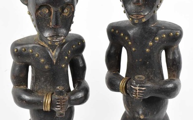 A pair of Fang, Gabon figures both with brass stud...