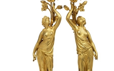 A pair of French gilt bronze and white marble candlesticks. First half of the 19th century. H. 43 cm. (2)