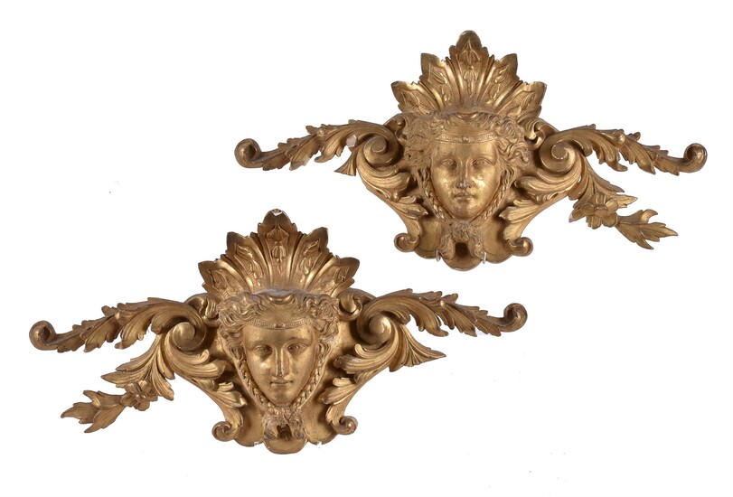 A pair of carved giltwood wall plaques in 18th century style
