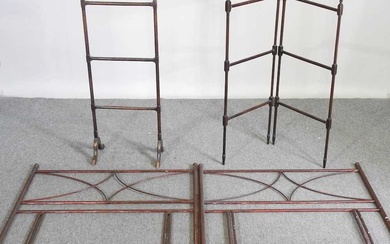 A pair of early 20th century metal single bed heads,...
