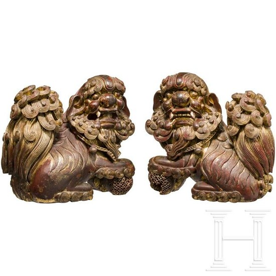 A pair of finely carved Chinese wooden fo-lions