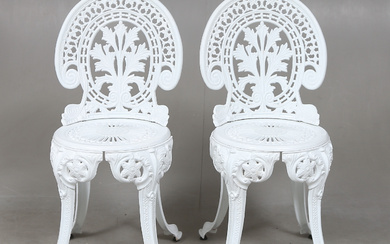 A pair of garden chairs.