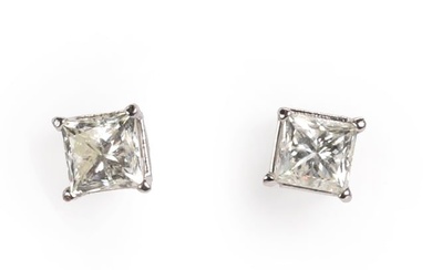 A pair of princess cut diamond stud earrings