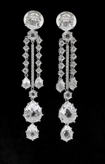 NOT SOLD. A pair of topaz and diamond ear pendants each set with numerous topazes...