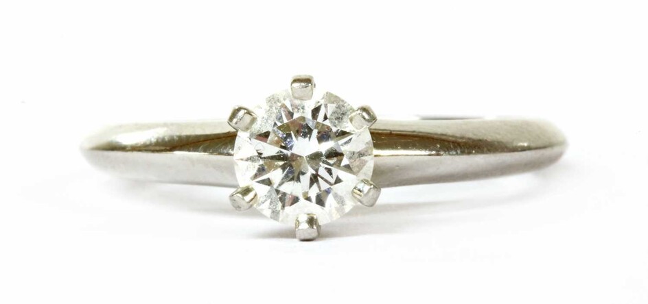 A platinum single stone diamond ring by Tiffany & Co.