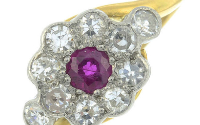 A ruby and diamond floral cluster ring.
