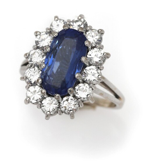 NOT SOLD. A sapphire and diamond ring set with a sapphire weighing app. 3.90 ct. encircled by diamonds, mounted in 18k white gold. Size 51. – Bruun Rasmussen Auctioneers of Fine Art