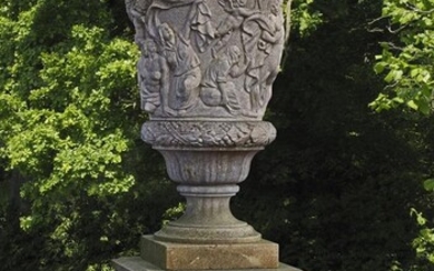 A sculpted limestone garden urn-and-cover