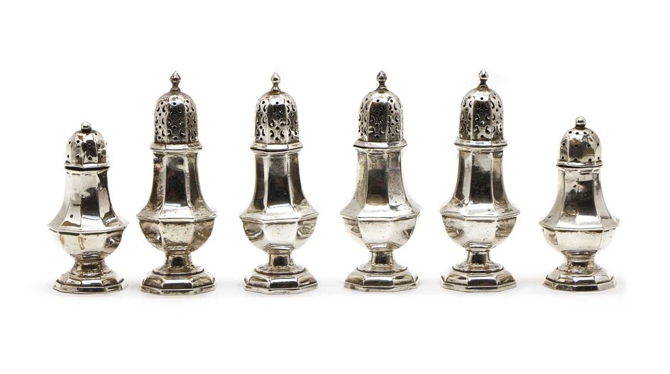 A set of four silver pepperettes