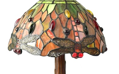 A small Tiffany-style table lamp with leaded stained glass shade,...
