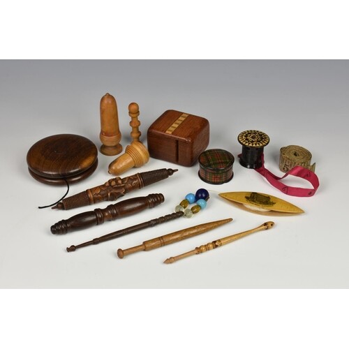 A small collection of antique treen sewing accessories, to i...