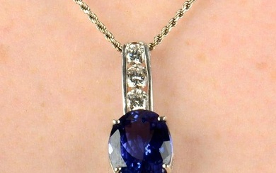 A tanzanite and brilliant-cut diamond pendant, with rope-link chain.Tanzanite calculated weight