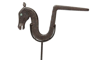 A tempered steel Mughal horse wall bracket, India, 17th century, the finial in the form of a horse's head with turquoise inlaid eyes, the nostrils flaring, open mouth and erect pointed ears which stand proud from the head of the horse, the full...