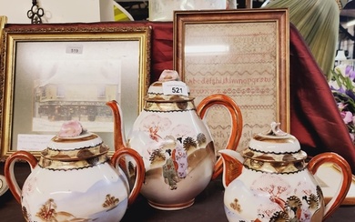 A three piece china tea set with oriental design.