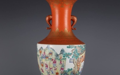 A vase with a red background and gold-painted enamels