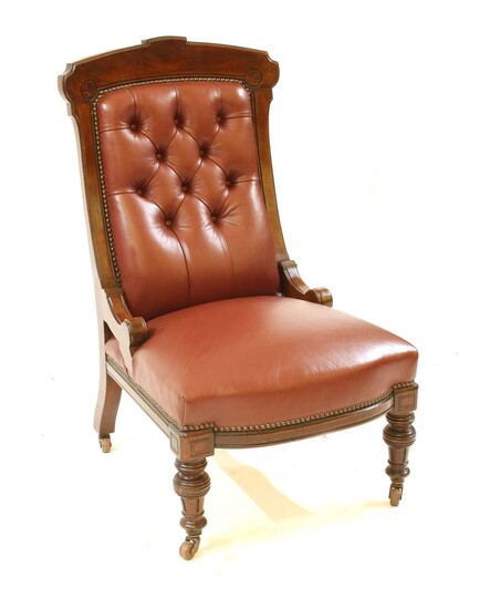 A walnut frame red leather button backed library chair