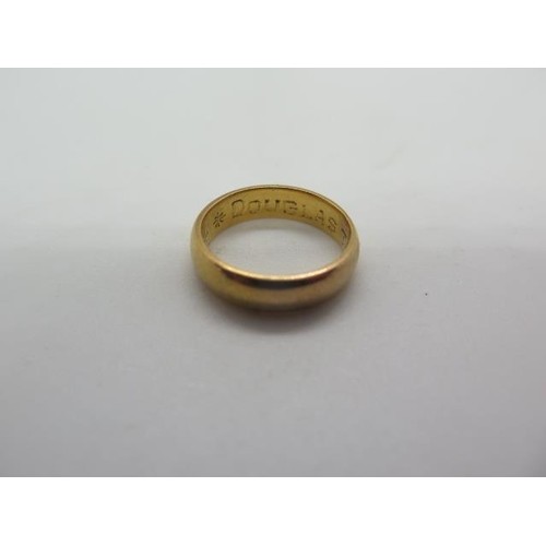 A yellow gold ring, engraved but not hallmarked, size J, app...