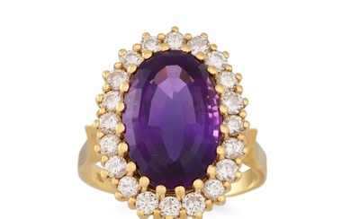 AN AMETHYST AND DIAMOND CLUSTER RING, the oval amethyst to b...