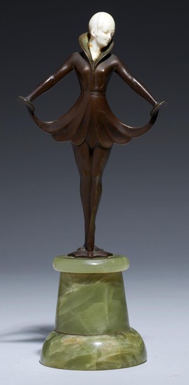 AN ART DECO BRONZE AND IVORY STATUETTE, C1930 turned onyx pl...