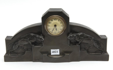 AN ART DECO BRONZE CASED MANTEL ALARM CLOCK, CAST TO THE FRONT WITH JAGUARS, 31 CM WIDE, 15.5 CM HIGH