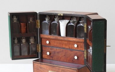 AN EARLY 19TH CENTURY MAHOGANY APOTHECARY CABINET, compact r...