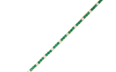 AN EMERALD AND DIAMOND LINE BRACELET comprising a row of round cut emeralds accented by round