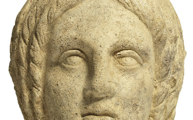 AN ETRUSCAN TERRACOTTA VOTIVE HEAD OF A WOMAN, CIRCA 4TH-3RD CENTURY B.C.