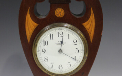 An Edwardian mahogany and boxwood inlaid mantel timepiece with eight day movement, the circular enam