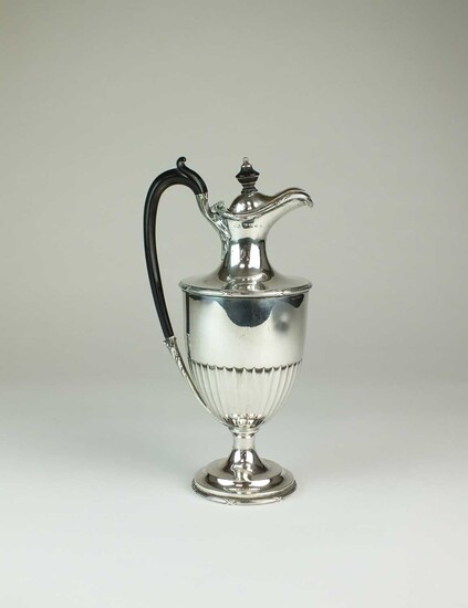 An Edwardian silver hot water jug