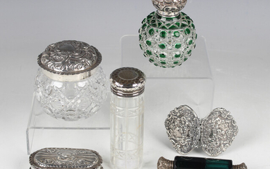 An Edwardian silver mounted green flash overlay cut glass globular scent bottle and stopper, London