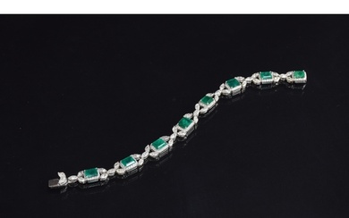 An exquisite 18ct white gold emerald and diamond bracelet, t...