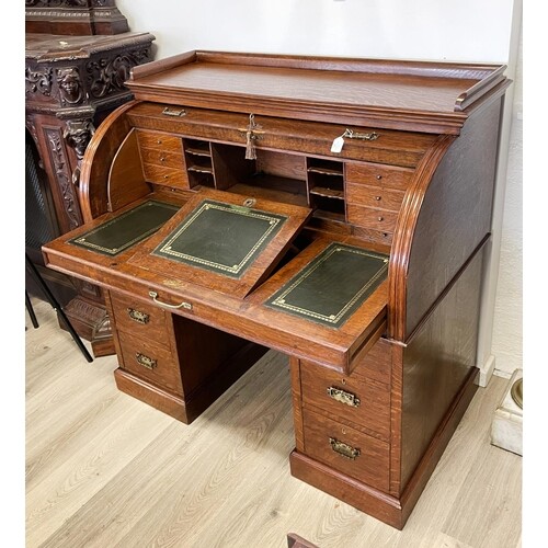 Antique Oak twin pedestal roll top desk, pull out leather to...