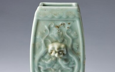 Arte Cinese A moulded celadon glazed vase bearing a