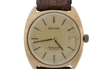 Bulova. An 18ct gold automatic calendar wristwatch Ambassador, Circa 1978 champagne dial with applied black batons and printed five minute markers, calendar aperture at 3, 23 jewel automatic 11AOACD movement, barrel shaped 18ct gold case with screw...