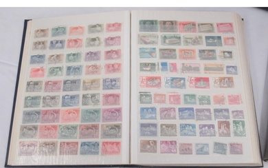 Collection of 5 stamps folders containing an assorted collec...