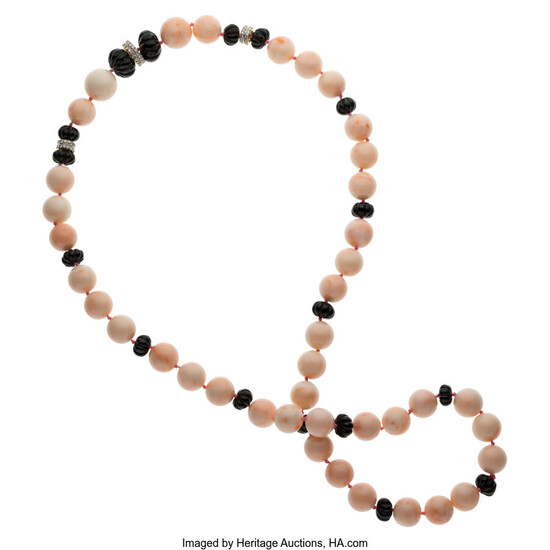 Coral, Diamond, Black Onyx, White Gold Necklace The necklace...