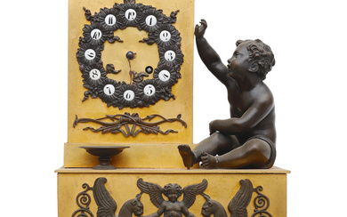 Empire style table clock in gilt and bluing bronze and "giallo antico" marble, first half of the 19th Century.