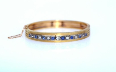 Fine gold bracelet with Diamonds and Sapphires.