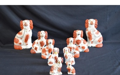 Four pairs of Staffordshire figures of Spaniels together wit...