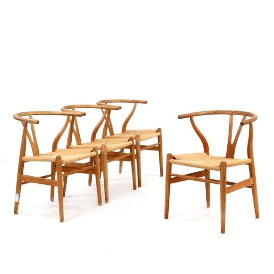 Hans J. Wegner: “Y-Chair/The Wishbone Chair”. Set of four armchairs with oak frame. Seats stretched with woven papercord. (4)