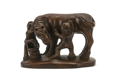 JAPANESE WOOD NETSUKE In the form of a horse being groomed by two monkeys. Signed. Length 2".