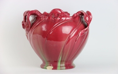 Jean MASSIER (1877-1937). Cache-pot en céramique émaillée polychrome à décor végétal. Signée sous la base...