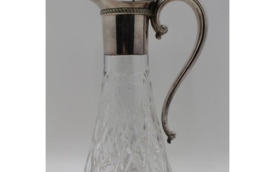 MAPPIN & WEBB, A SILVER MOUNTED CUT GLASS CLARET JUG, hinged...