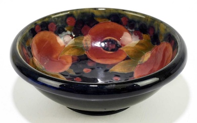 MOORCROFT; a 'Pomegranate' pattern bowl, with shaped rim, impressed marks...