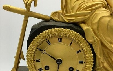 Mantel clock with a sculptural image of the patroness