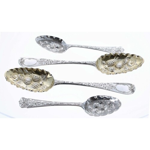 Pair of Russian silver fruit spoons, with embossed gilt bowl...