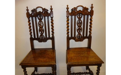 Pair of antique carved oak hall chairs.